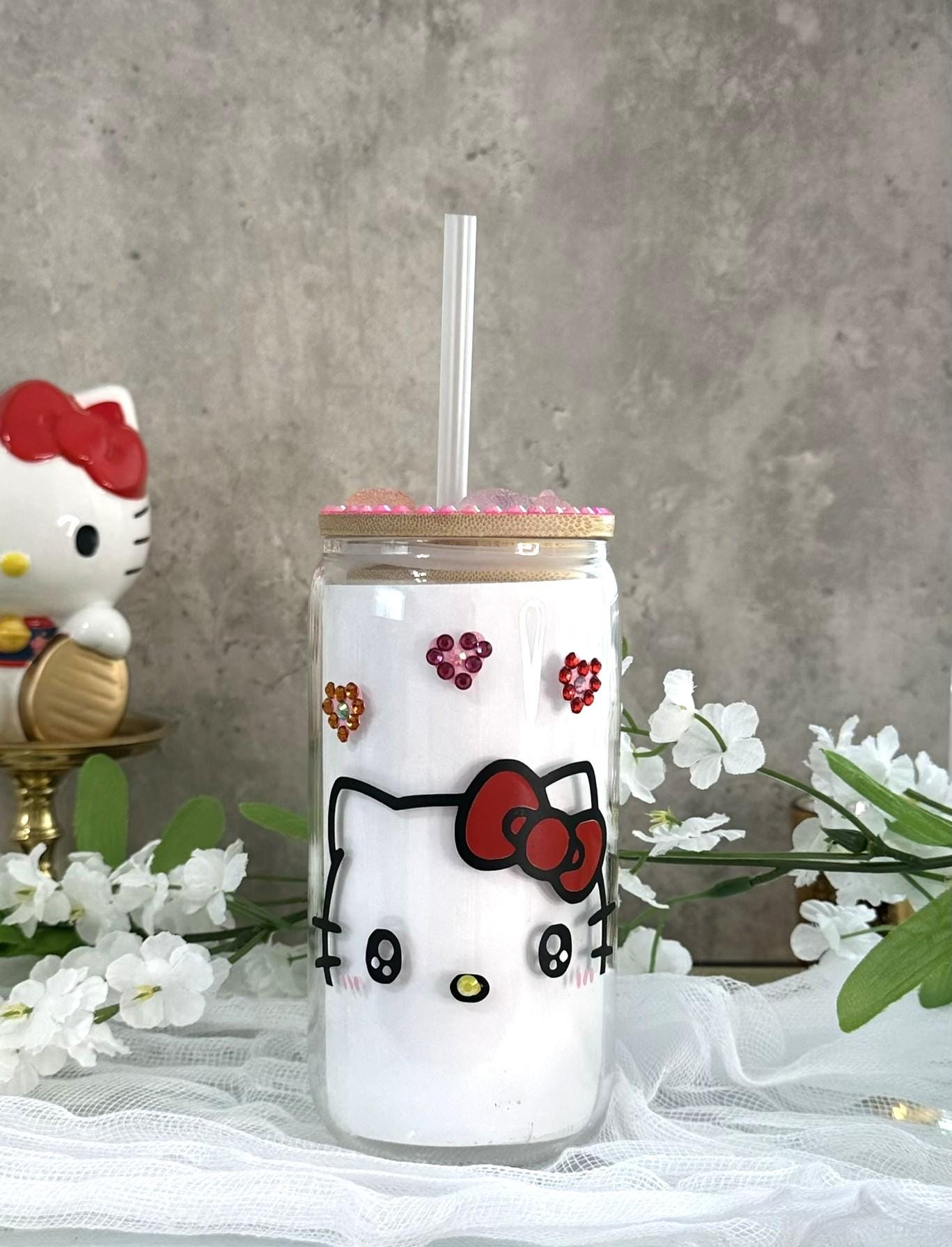 Bring a little sparkle into your daily routine ✨
This dreamy Hello Kitty 💗 glass cup is handmade with love — featuring the iconic kawaii kitty, a rhinestone-lined bamboo lid, and adorable gummy bear resin charms. Each one is made to make your morning iced coffee or matcha feel ✨extra✨.

Soft, romantic, and full of personality — this cup is perfect for every occasion, whether you're working from home, journaling at a café, or gifting your bestie something sweet.